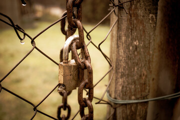 abandoned zone with rusty chain and padlock