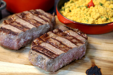 Rib Eye steak grilled in barbecue grill. With excellent accompaniment to meats.