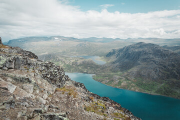 River and lake in the mountains. Sky in the clouds Norwegian mountains
