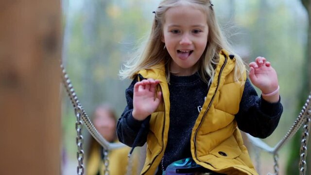 portrait of smiling little girl running in park. Happy child in the park. Slow motion video. stock footage