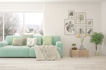 White living room with sofa and winter landscape in window. Scandinavian interior design. 3D illustration