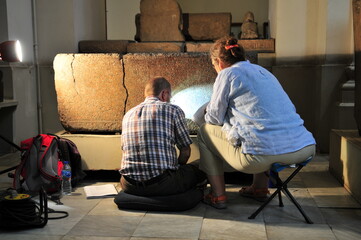 Egyptologists deciphering hieroglyphs in the Egyptian Museum, Cairo
