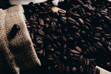Coffee beans and coffee cup with coffee,old bag - obrazy, fototapety, plakaty