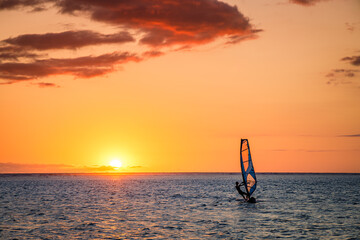 Man windsurfing at sunset on Reunion Island