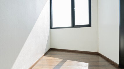 White empty room with window White on the floor, covered with brown.
