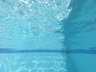 sun reflection under water in swimming pool