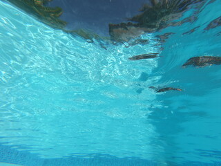 sun reflection under water in swimming pool