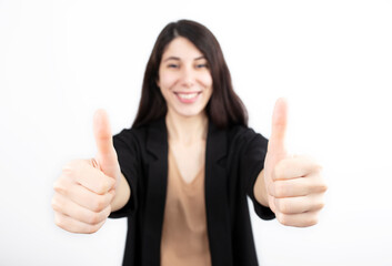 Business woman in black suit over white background.OK hand thumbs up or check mark.
