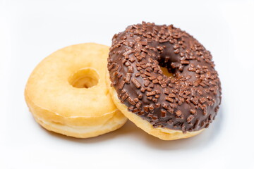 Two delicious round sweets on white background