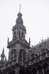  On the Grand Place Square is City Hall. The weather is cloudy