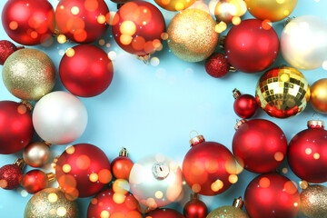 Beautiful Christmas or New Year background with place for text on colored background top view with golden bokeh.