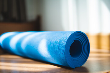 ํYoga mat  Exercise mat on the floor with sunlight in the morning at home