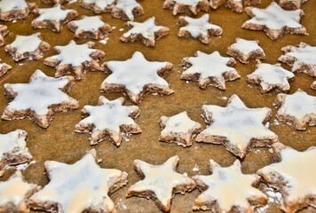 cinnamon stars, cookies flat layed on a baking sheet, ready to be baked