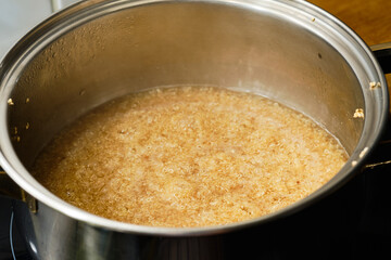 Preparing quinoa in cooking pot