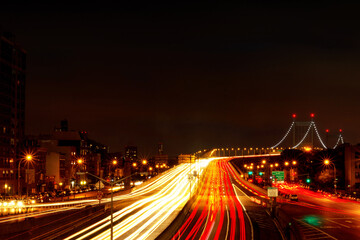Fototapeta na wymiar Long exposure of traffic leading to the Triborough Bridge, or the Robert F Kennedy Bridge, in New York City