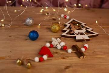 Christmas toys and lights on a wooden table