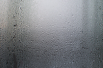 Vapors on the glass, water drops on the window
