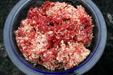 Fresh Raw mince, Minced beef. Close-up of minced meat in a glass bowl, Minced meat mix with fat for homemade sausage, Minced meat background