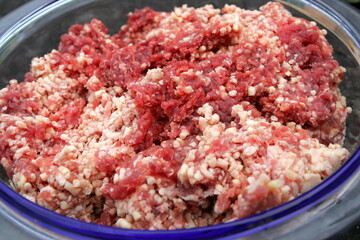 Fresh Raw mince, Minced beef. Close-up of minced meat in a glass bowl, Minced meat mix with fat for homemade sausage, Minced meat background