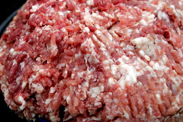 Fresh Raw mince, Minced beef. Close-up of minced meat in a glass bowl, Minced meat mix with fat for homemade sausage, Minced meat background