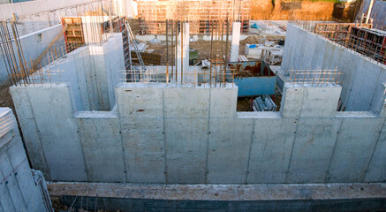 foundations of a small building with concrete walls and pillars