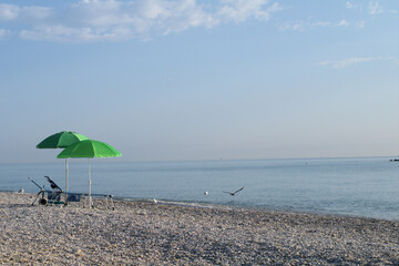 beach with umbrellas,summer, sky, parasol,travel, water, coast, holiday, sun,relax, tourism,