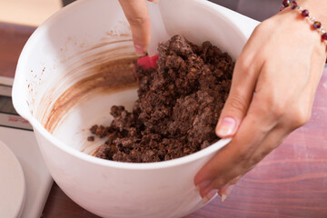 The process of making a cheesecake crust.