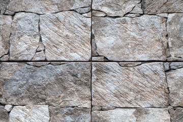 Artificial stone backdrop is similar to natural.