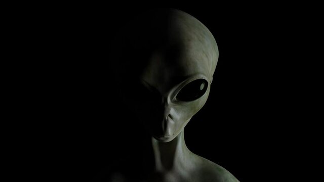 Spooky alien's face on black background. UFO and extraterrestrial life concept.