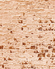 Historic Brick Wall Beige Background. Sepia Toned Brickwork Vertical Banner. Historic Map Material. Rough Shabby Plaster Sidewalk. Weathered Wallpaper Web Design.