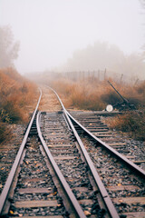 Fototapeta na wymiar Train tracks on a foggy day