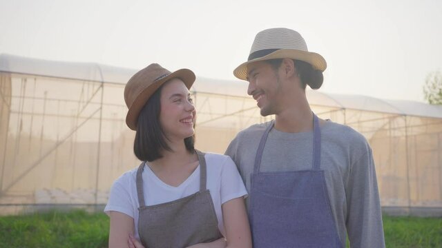 Portrait of Asian young farm owner couple smiling and look at camera.