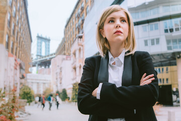 Businesswoman in a black suit walking in New York City