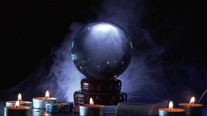 Magical fortuneteller's glass ball for predicting and telling the future. Smoke around.