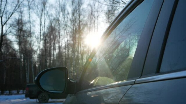 girl throws trash out of the car window. Environmental pollution by drivers. Prolongation of environmental pollution