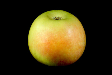 Ripe fresh Apple on a black background.