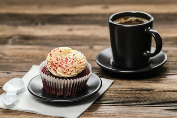 Cup of coffee on a saucer, sponge cake with Bizet and cinnamon crumbs.