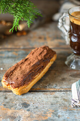 eclairs chocolate-covered in chocolate berry cut cream profiteroles ready to eat on the table healthy meal snack ingredient top view copy space for text food background rustic