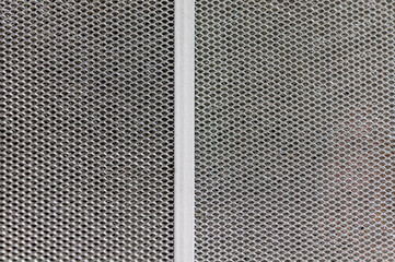 London, United Kingdom, December 05, 2020: Aluminium mesh pattern on black gradient background vector 
