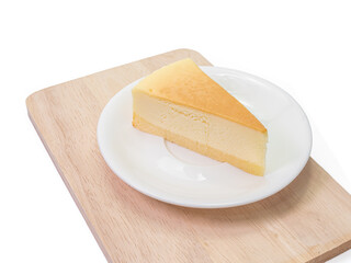 The close up of sliced yummy cheesecake bakery sweet dessert on wood cutting board isolated on white background.