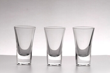 Three alcoholic multicolored alcoholic shots for advertising layout