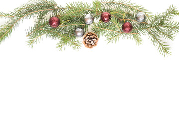 Spruce branches with decorations on a white background.