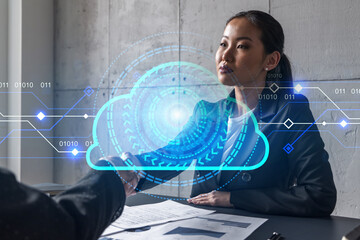 Two woman handshake. Storage data concept cloud hologram. Multiexposure. International business.