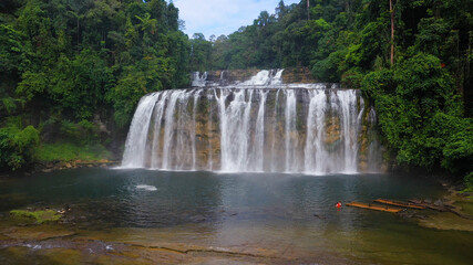 Beautiful waterfall in the rainforest. Tinuy an Falls Waterfall in the tropical mountain jungle. Philippines, Mindanao.
