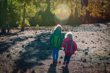 little girls travel in nature, family hiking in mountains