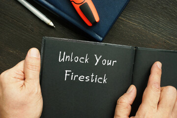 Lifestyle concept about Unlock Your Firestick with inscription on the piece of paper.