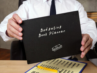  Budgeting Book Planner K phrase on the piece of paper.