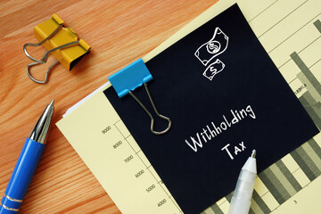 Financial concept meaning Withholding Tax with phrase on the sheet.