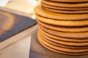 Cooking honey cake at home. Many round baked cakes on top of each other, blanks without cream.