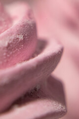 Abstract macro lines meringue. Colored sweet pink dessert zephyr or marshmallows in pastel colors. close-up, selective focus.